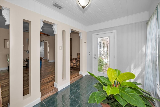 546 Orangewood Dr, Dunedin, FL 34698 - entrance foyer with dark tile patterned floors and baseboards