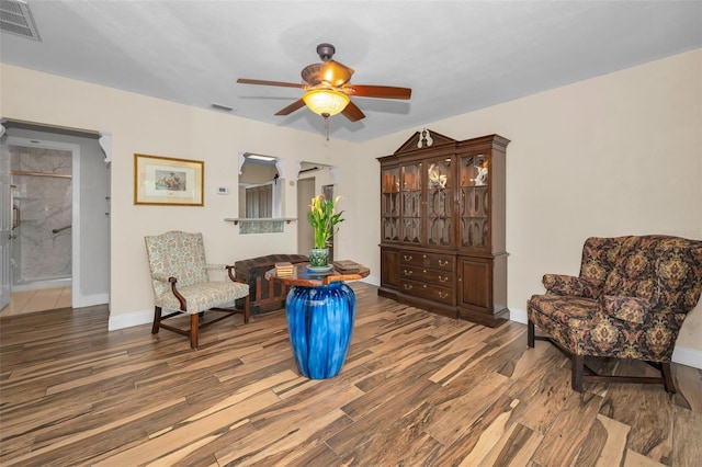 546 Orangewood Dr, Dunedin, FL 34698 - living area with wood finished floors, ceiling fan, and baseboards
