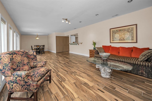546 Orangewood Dr, Dunedin, FL 34698 - living room with wood finished floors and baseboards