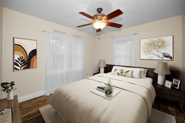 546 Orangewood Dr, Dunedin, FL 34698 - bedroom with wood finished floors, baseboards, and ceiling fan