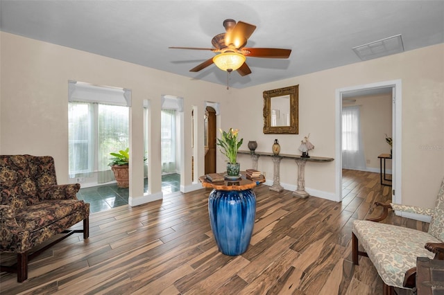 546 Orangewood Dr, Dunedin, FL 34698 - sitting room featuring wood finished floors, a ceiling fan, and baseboards
