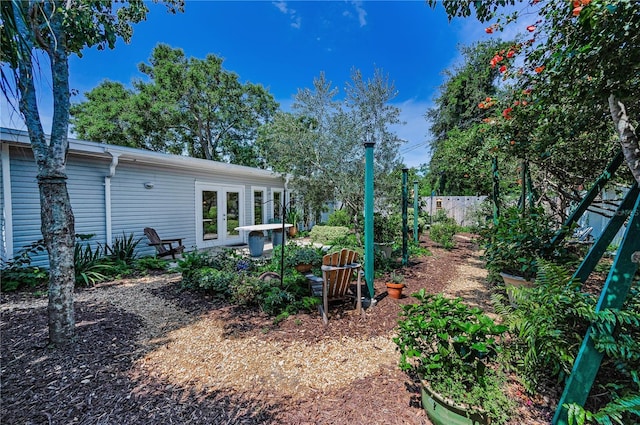 546 Orangewood Dr, Dunedin, FL 34698 - view of yard with french doors