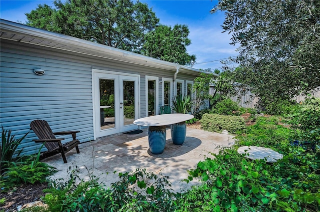 546 Orangewood Dr, Dunedin, FL 34698 - view of patio featuring french doors
