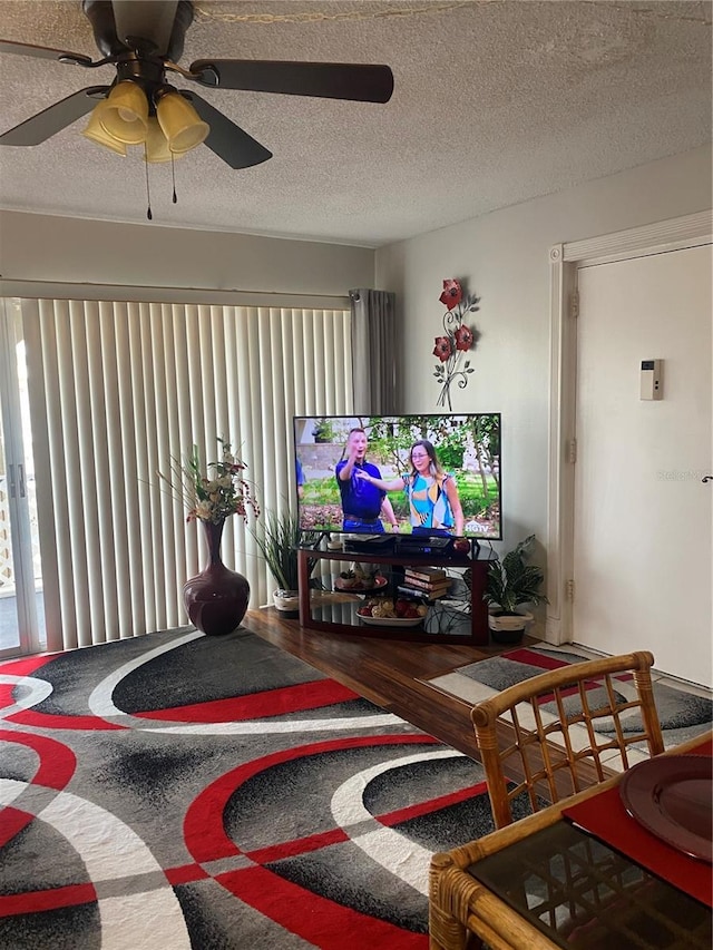 living room with hardwood / wood-style flooring and a textured ceiling