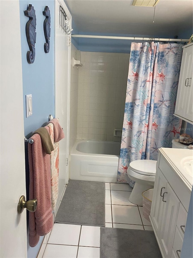 full bathroom featuring tile patterned floors, toilet, shower / tub combo, and vanity