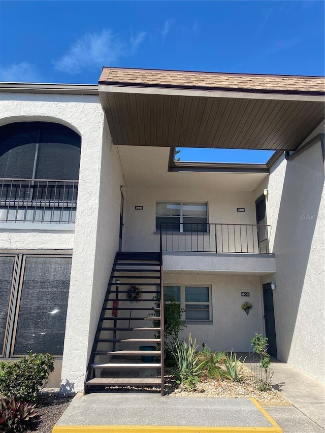 entrance to property with stucco siding