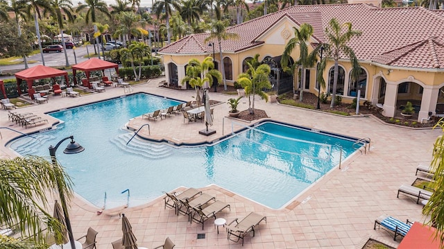 view of swimming pool featuring a gazebo and a patio