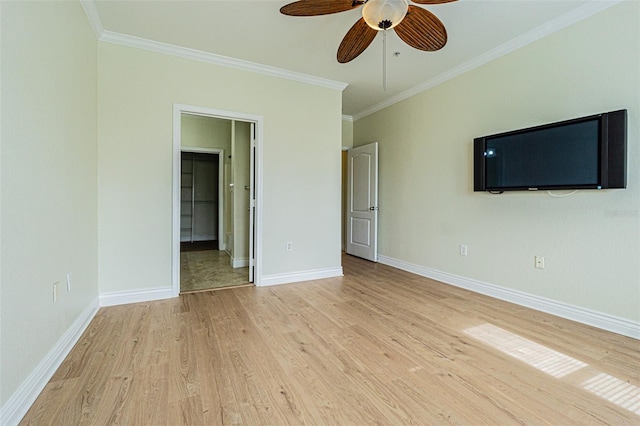 interior space featuring ceiling fan, ornamental molding, and light wood-type flooring