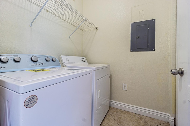 laundry room featuring independent washer and dryer, electric panel, and light tile patterned flooring