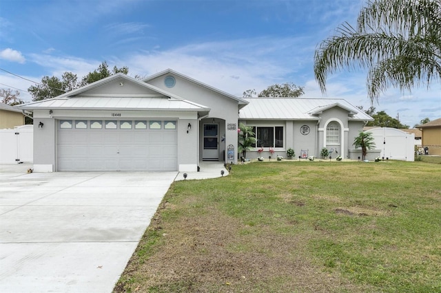 single story home featuring a garage and a front lawn