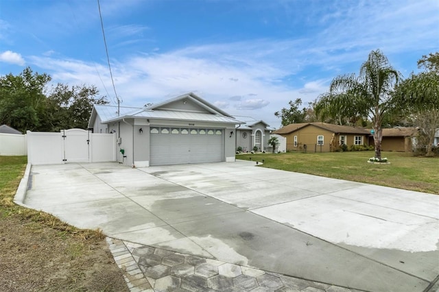 single story home featuring a garage and a front lawn