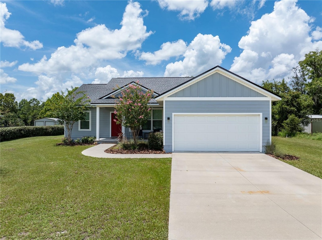 view of front facade featuring a garage and a front yard