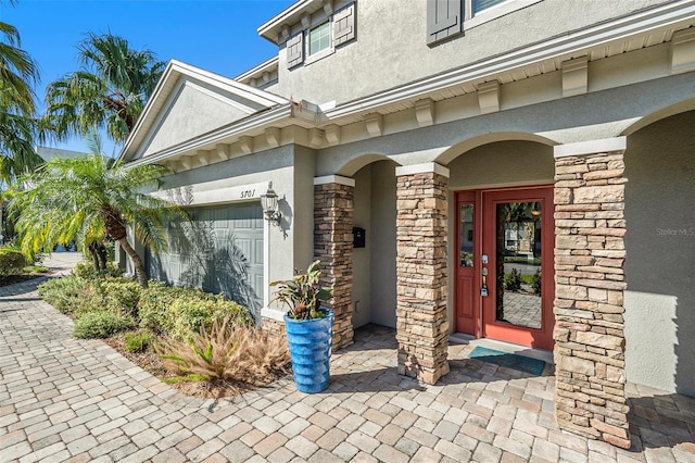 doorway to property featuring a garage