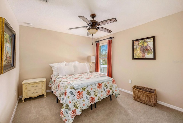 bedroom featuring carpet flooring, a ceiling fan, and baseboards