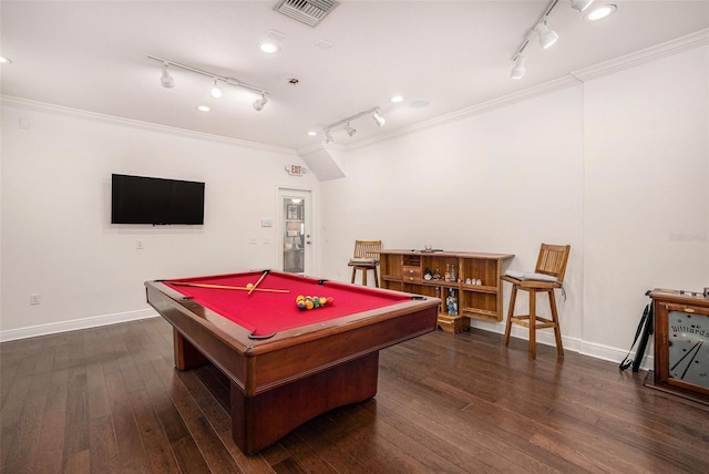 recreation room with dark wood-style floors, visible vents, crown molding, and baseboards