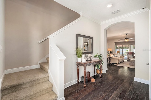 5701 S Macdill Ave, Tampa, FL 33611 - stairway featuring ornamental molding, arched walkways, hardwood / wood-style floors, and a ceiling fan