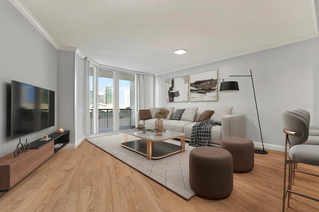450 Knights Run Ave Unit 605, Tampa, FL 33602 - living room with expansive windows, crown molding, and light hardwood / wood-style floors
