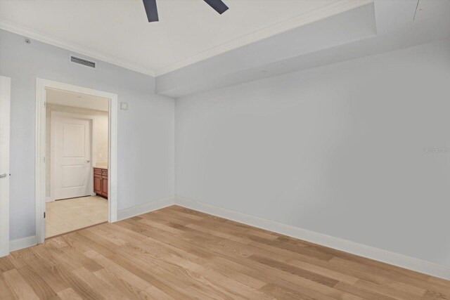 450 Knights Run Ave Unit 605, Tampa, FL 33602 - unfurnished room featuring crown molding, ceiling fan, and light wood-type flooring