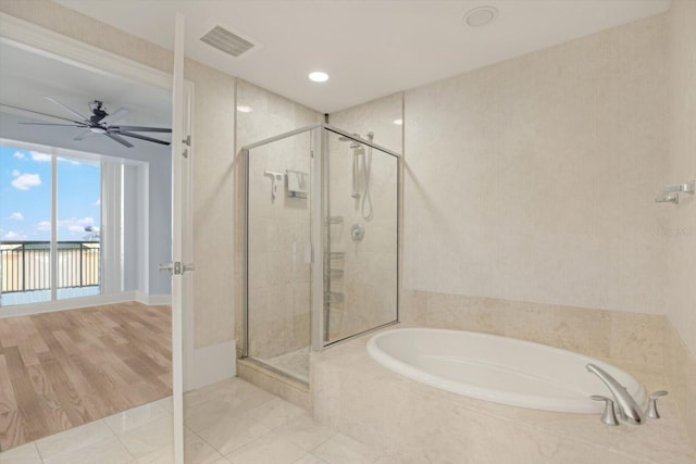 450 Knights Run Ave Unit 605, Tampa, FL 33602 - bathroom with tile patterned floors, shower with separate bathtub, and ceiling fan