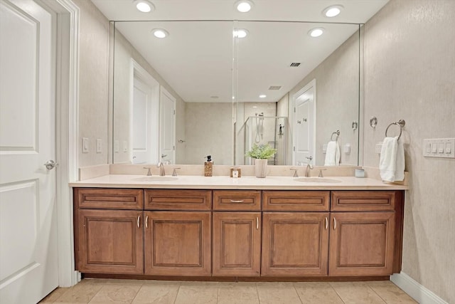 450 Knights Run Ave Unit 605, Tampa, FL 33602 - bathroom with vanity, tile patterned flooring, and a shower with door