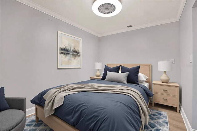 450 Knights Run Ave Unit 605, Tampa, FL 33602 - bedroom with ornamental molding and light hardwood / wood-style floors