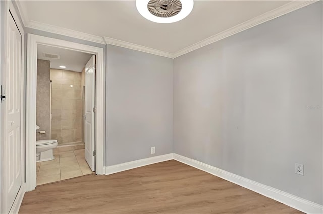 450 Knights Run Ave Unit 605, Tampa, FL 33602 - spare room with ornamental molding and light hardwood / wood-style floors