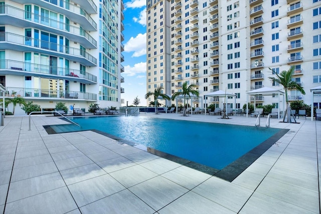 450 Knights Run Ave Unit 605, Tampa, FL 33602 - view of pool featuring pool water feature and a patio