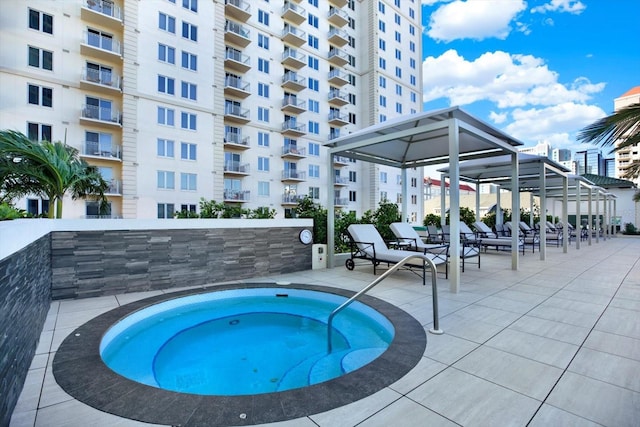 450 Knights Run Ave Unit 605, Tampa, FL 33602 - view of pool featuring a community hot tub and a patio