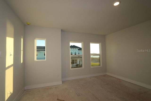 empty room featuring baseboards