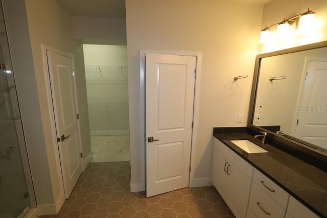 bathroom featuring baseboards and vanity