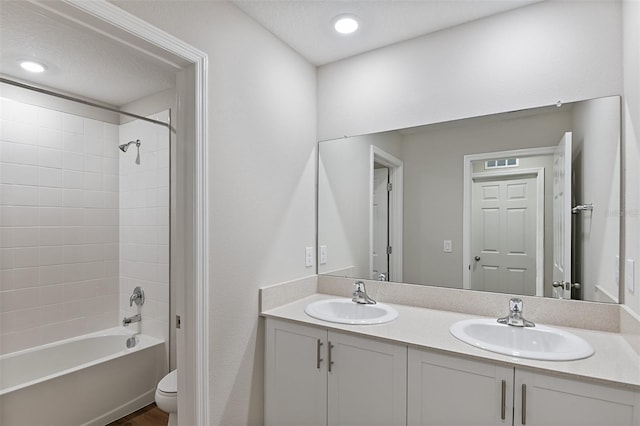 full bathroom with toilet, bathtub / shower combination, and vanity