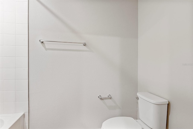 bathroom featuring toilet and separate shower and tub