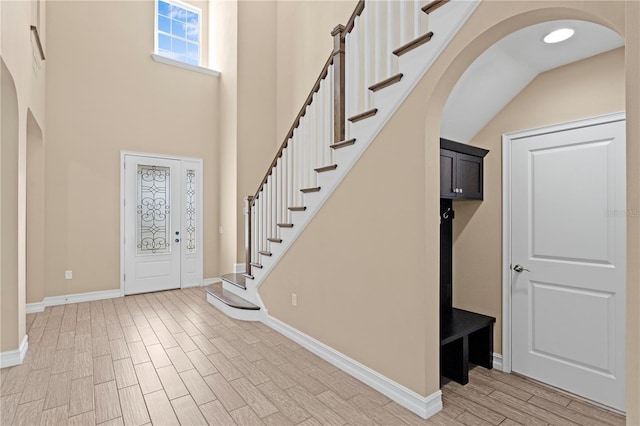 foyer entrance with a high ceiling