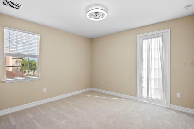 empty room with light colored carpet