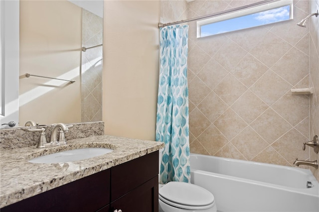 full bathroom featuring vanity, shower / tub combo with curtain, and toilet