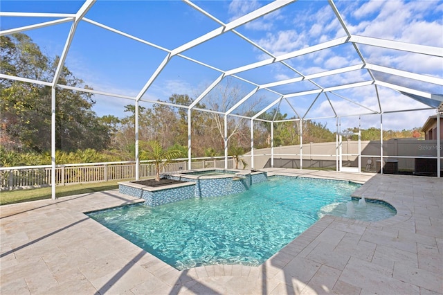 view of pool with an in ground hot tub, a lanai, and a patio area