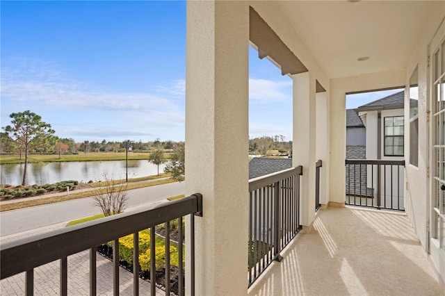 balcony featuring a water view