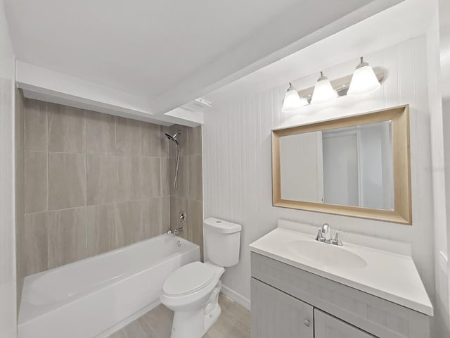 full bathroom featuring vanity, toilet, and tiled shower / bath