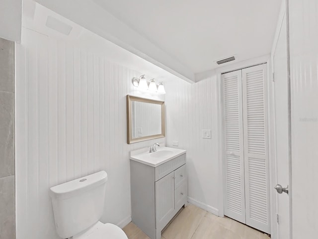 bathroom featuring tile patterned floors, toilet, and vanity