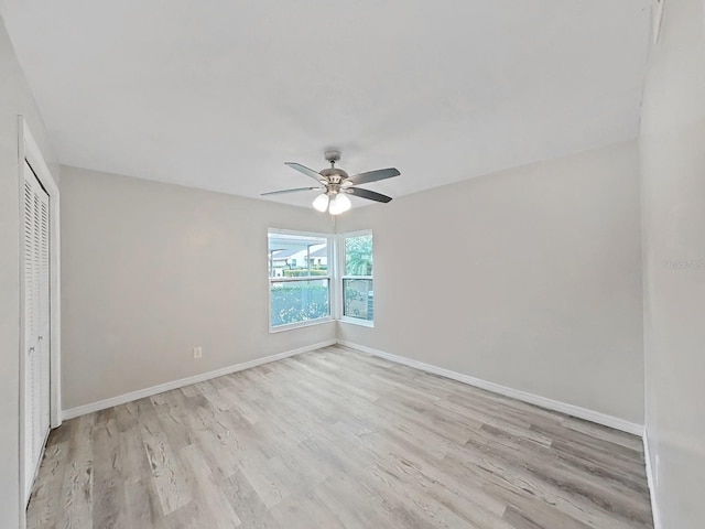 unfurnished bedroom with a closet, ceiling fan, and light hardwood / wood-style flooring