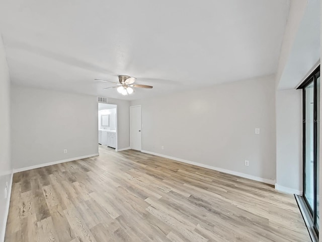 spare room with light hardwood / wood-style floors and ceiling fan