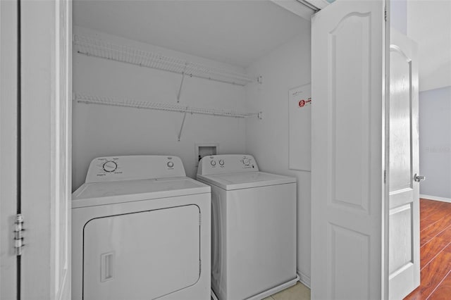 laundry area featuring separate washer and dryer