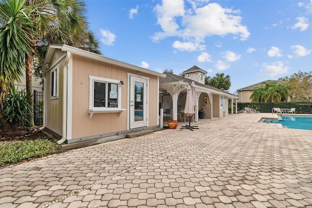 back of property featuring a patio area