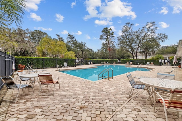 view of swimming pool featuring a patio area