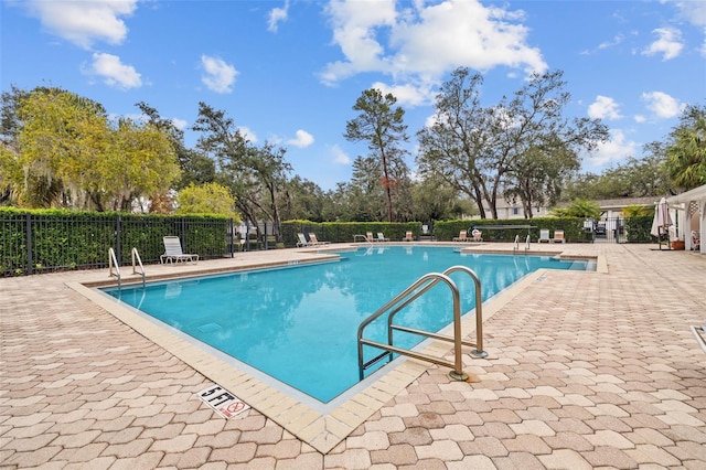 view of swimming pool featuring a patio area