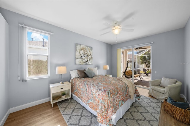 bedroom with ceiling fan, light wood-type flooring, and access to outside