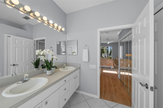 bathroom with vanity and tile patterned flooring