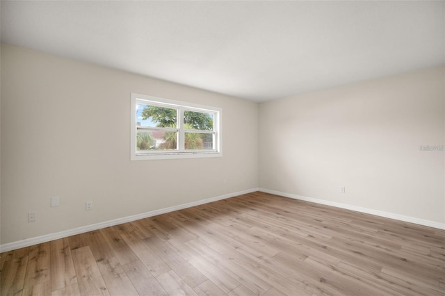 spare room featuring light hardwood / wood-style floors