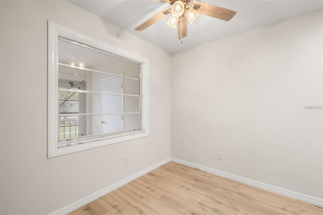 spare room with light hardwood / wood-style flooring and ceiling fan