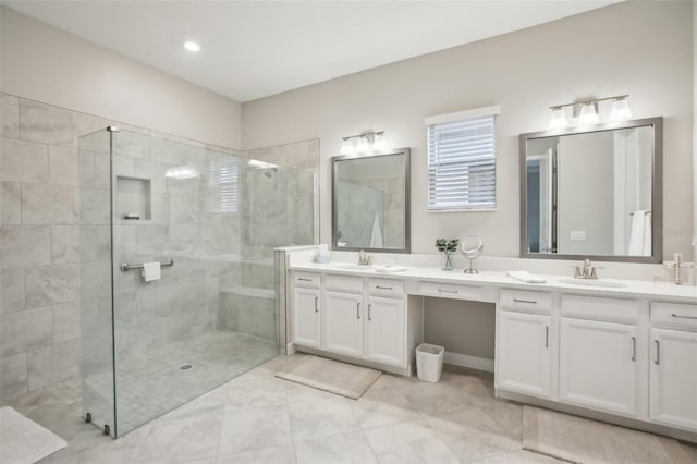 bathroom featuring vanity, tile patterned flooring, and a shower with door